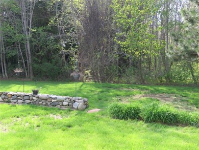 Extends into the woods to the rear.