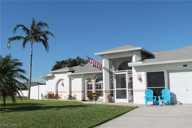 Front of home features screened patio entry and screened garage door.