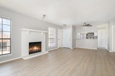 Living room featuring light wood-type flooring, a 