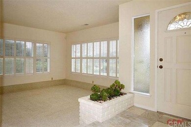 Tiled entry with step down into living room. Multi