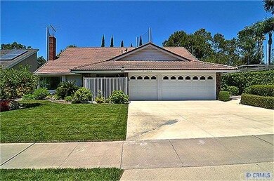 Front View with Gated Entry, 3-Car Garage and Larg