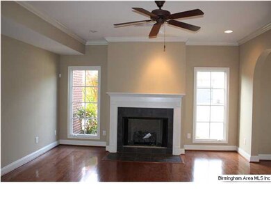 GREAT ROOM WITH HARDWOOD FLOORING AND GAS LOG FIRE