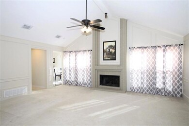 LIVING ROOM W VAULTED CEILING AND FIREPLACE