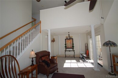 Dramatic vaulted two-story family room flows into
