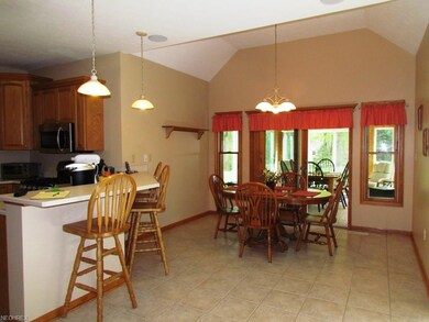 LARGE EATING AREA LOOKING INTO FOUR SEASONS ROOM! 