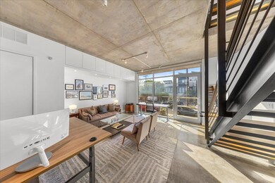 Living area with expansive windows and finished c