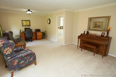 From entryway to the left of staircase a spacious