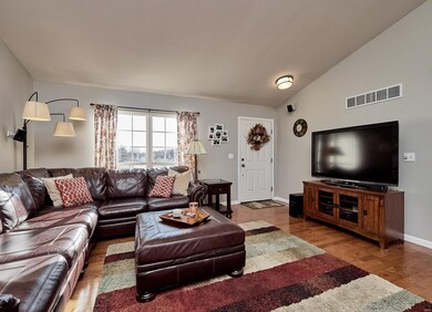 Beautiful gleaming wood floors greet you at the fr