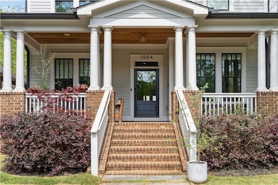 View of exterior entry with covered porch