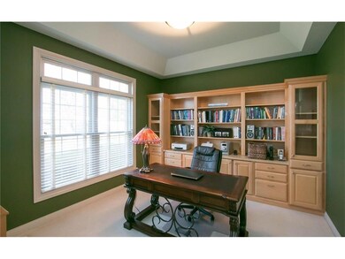 Bright, private office area with tray ceilings and