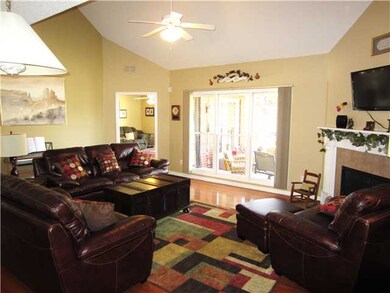 The greatroom boasts vaulted ceilings, neutral pai