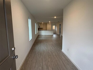 Hall with hardwood / wood-style floors