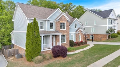 View of front of house with a front lawn, covered 