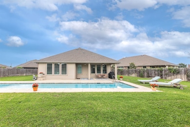 The backyard has a 20 yard lap pool. It is 4 feet deep end to end and is perfect for both swimming or walking laps in the sunshine.