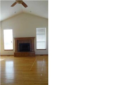 Vaulted ceiling and wood burn fireplace greet your