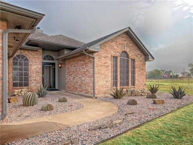 Exterior Front. Custom Xeriscaped front flower bed