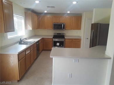 Kitchen with appliances with stainless steel finis