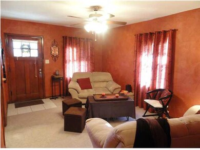 Open living room painted in warm colors