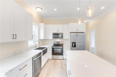 Kitchen with Large Island and Stainless Steel Appl