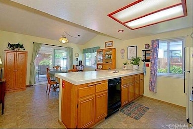 Kitchen has peaceful views out windows.  Large ope