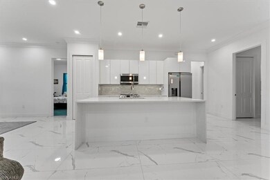 Kitchen with appliances with stainless steel finis