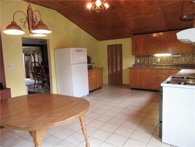 Opens to the living room, and the mud room that le