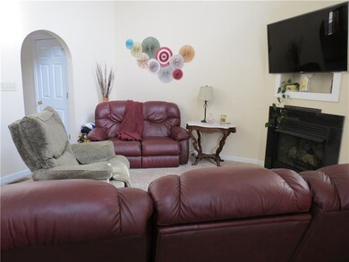 Another view of the living room and its arched ent