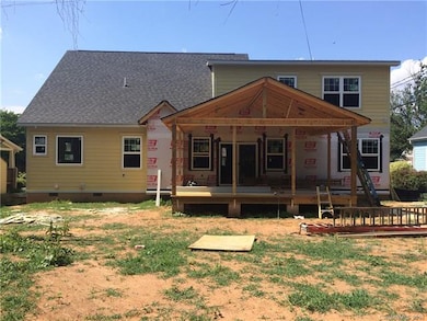 Back of home with beautiful large porch ready for 