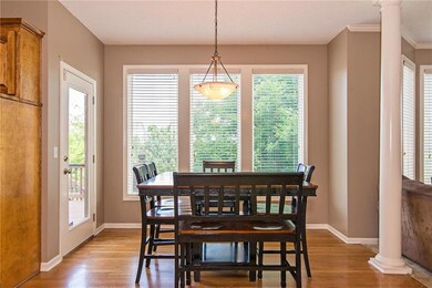Spacious breakfast area with door leading to the d