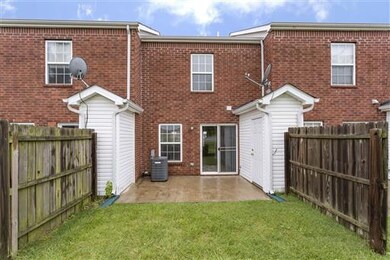 patio, storage room and privacy fences in back