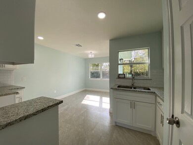 Kitchen has plenty of Natural light.