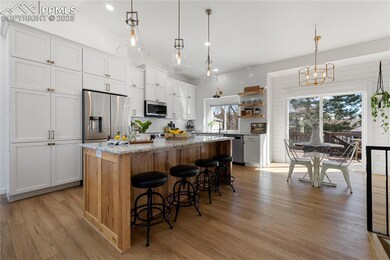 Kitchen featuring stainless steel appliances, ligh