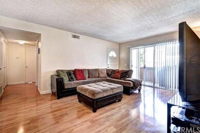 Living room opens up to private patio.