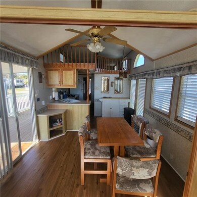Opens to kitchen and family room.  View of loft ar