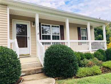NICE COVERED PORCH OVERLOOKS LARGE FRONT YARD IN PRIVATE CUL DE SAC