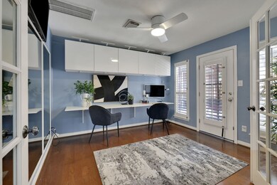 Step through French doors into a dedicated office