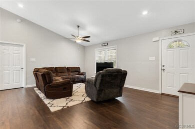 Living room with dark hardwood / wood-style floors