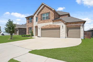 View of front of property featuring driveway, a f