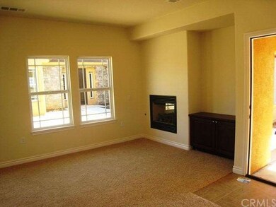Casita living room features fireplace and built in