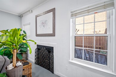 This inviting corner of the townhome features a ch
