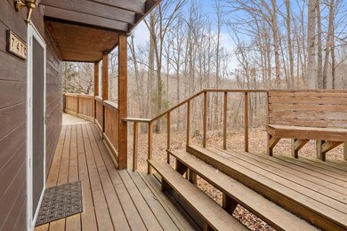 Great sitting area to enjoy the outdoors just off the front door.