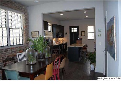 Hand-scraped hardwood floors throughout
