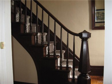 Foyer. The front foyer boasts the original stairca