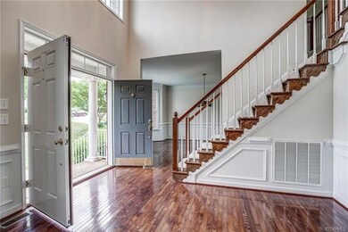 Dramatic 2 Story Foyer with Double Front Doors.  H