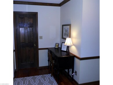 Foyer with chair rails, double crown moldings, doo