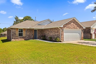 Ranch-style house with an attached garage, concret