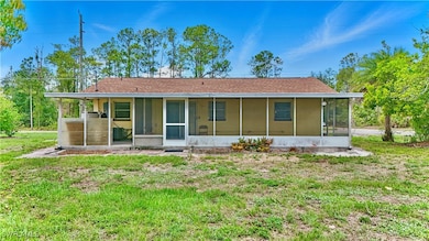View of front of house featuring a sunroom and a f