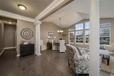 Exquisite crown molding and pillars create a sophi