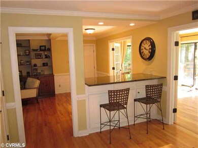 Kitchen - Bar area with granite and custom cabinet