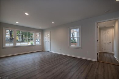 Great Room.  Beautiful Picture Window provides brightly lite room. Perfect size for Sofa/Loveseat and TV on Wall between door and window.  Hallway to Master Suite.